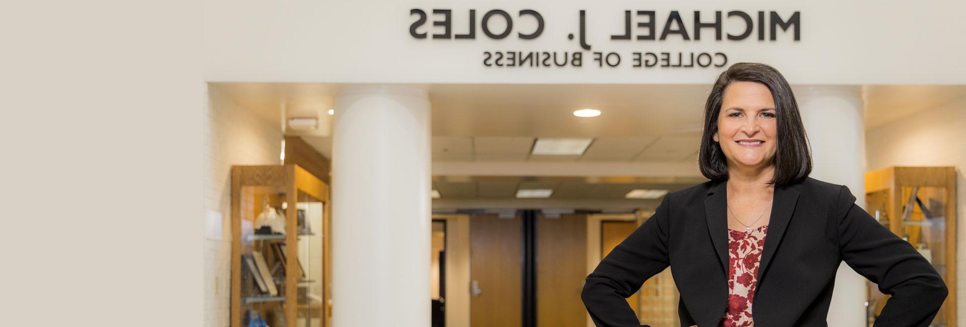 Dr. Robin Cheramie standing in front of coles school of business