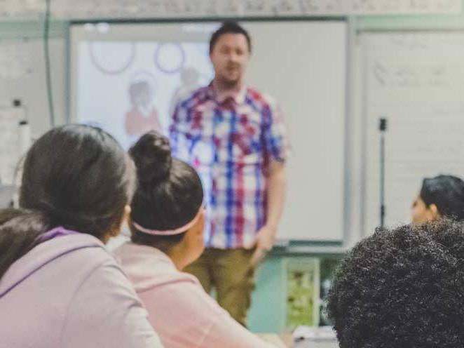 Teacher teaching a group of students